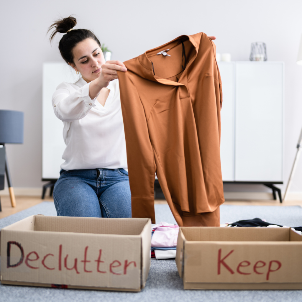 Woman Decluttering Clothes, Sorting