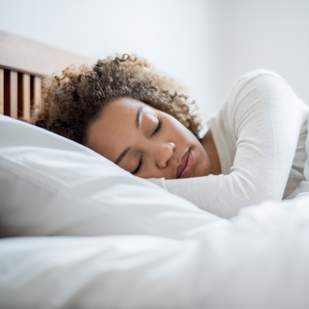 Black woman sleeping in bed