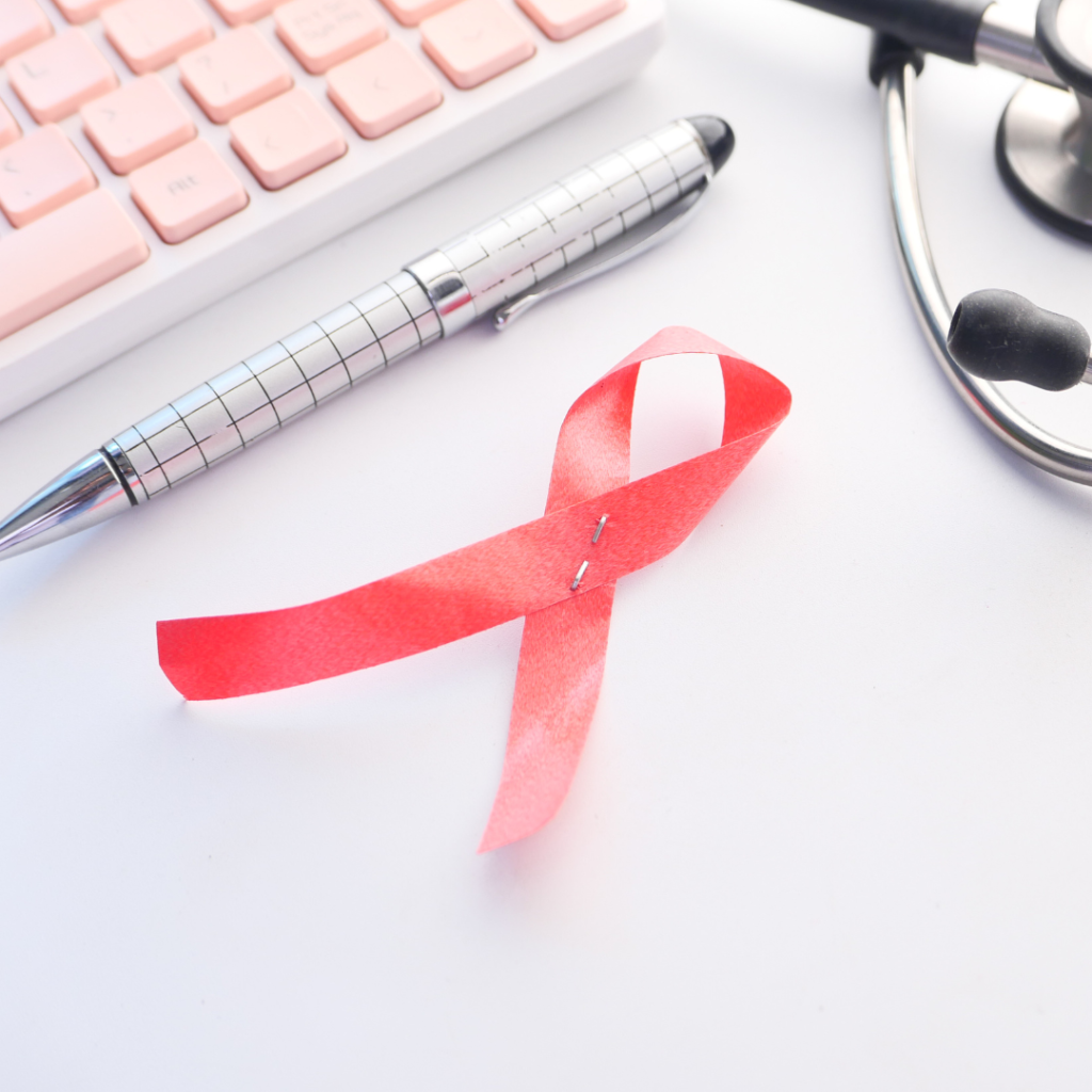 Red Ribbon HIV, and Stethoscope on White Background.
