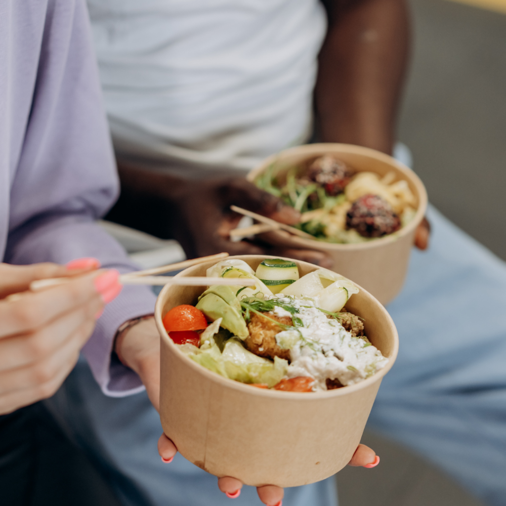 Two People Eating Healthy Food In Bowls