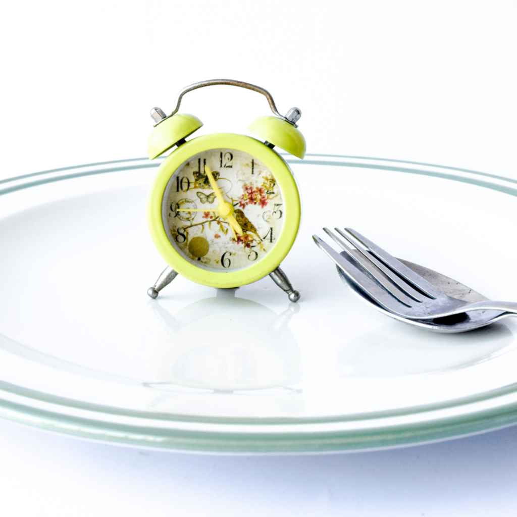 Vintage Alarm Clock in a Plate with Cutlery