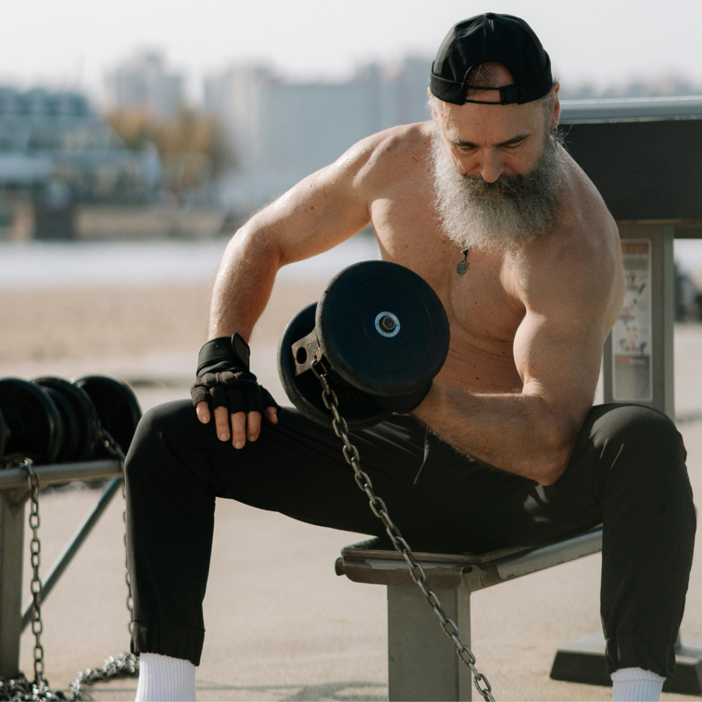 A Man Lifting Dumbbells in the Park