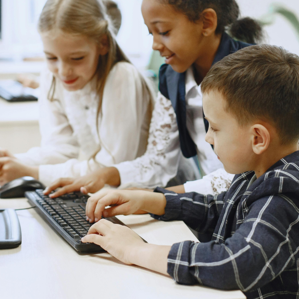 Kids in a Computer Lab Typing on a Keyboard