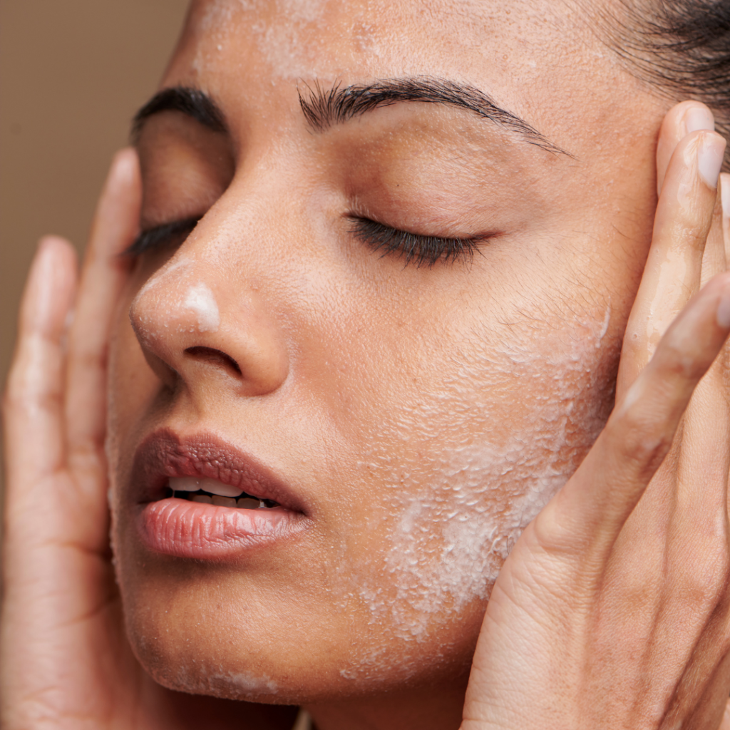 Woman Applying Skincare on Face