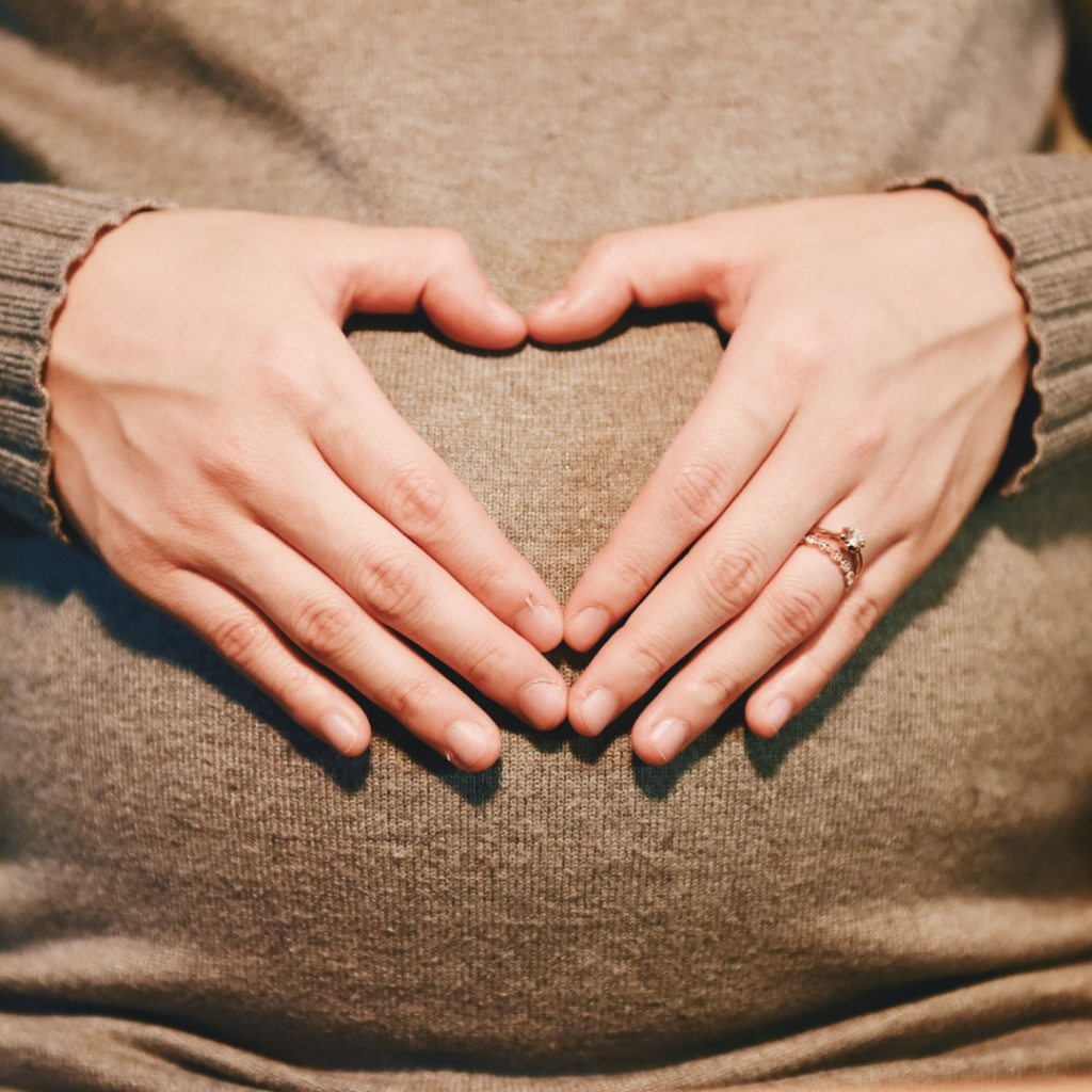 Woman Holding Her Pregnant Belly