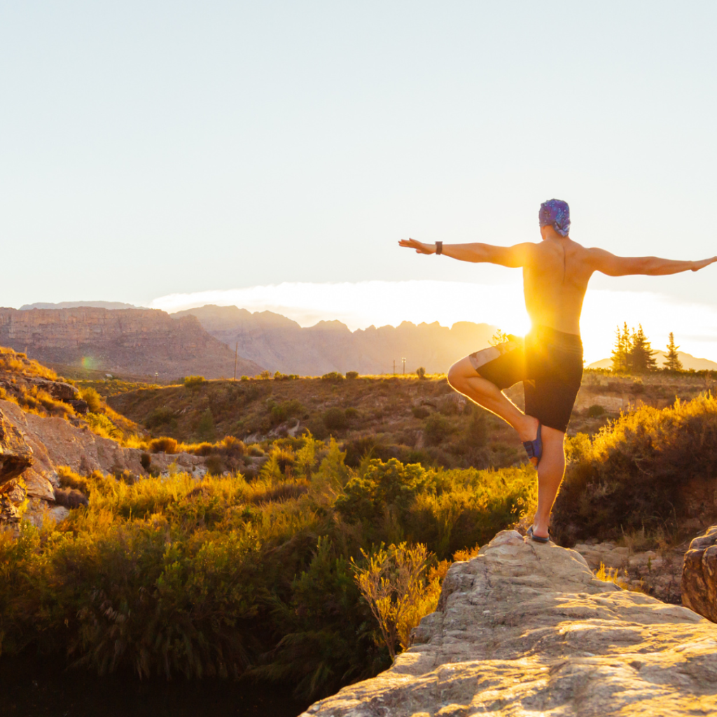 Man Standing on Brown Cliff