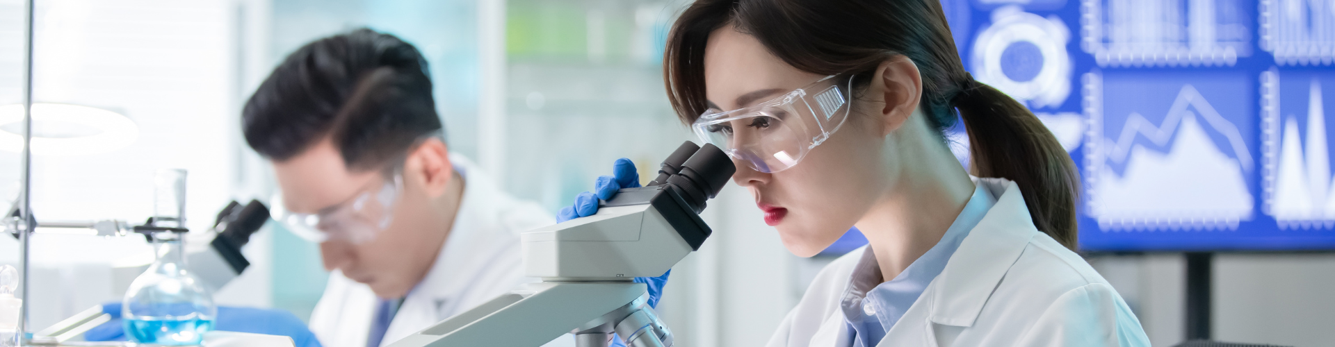 Scientists Using Microscope