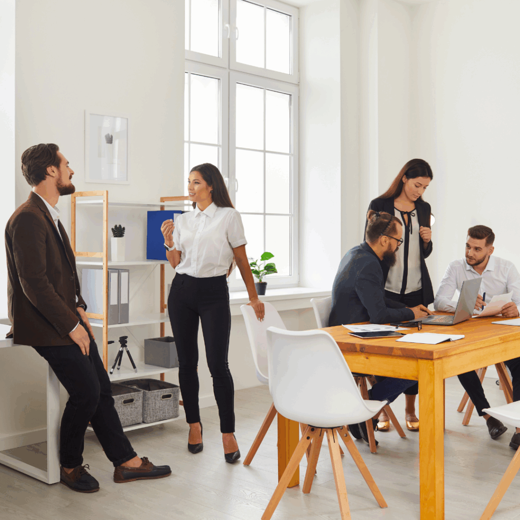 Young People Meeting in Cozy Modern Workspace and Discussing Their Business Projects