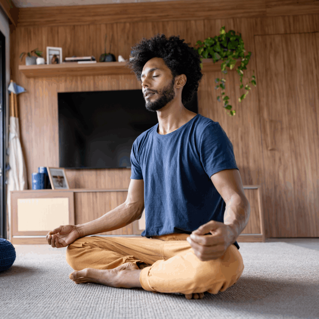 Man meditating at home