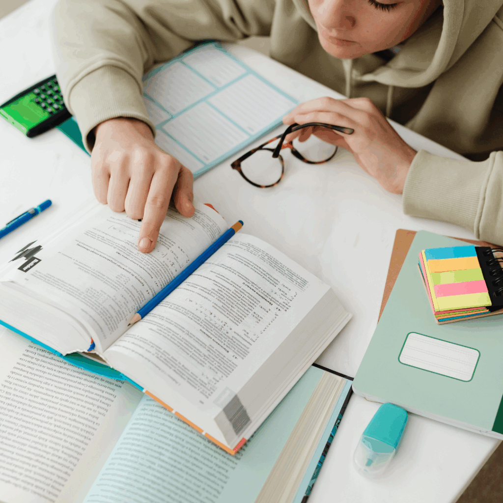 Young Man Reading A Book and Studying