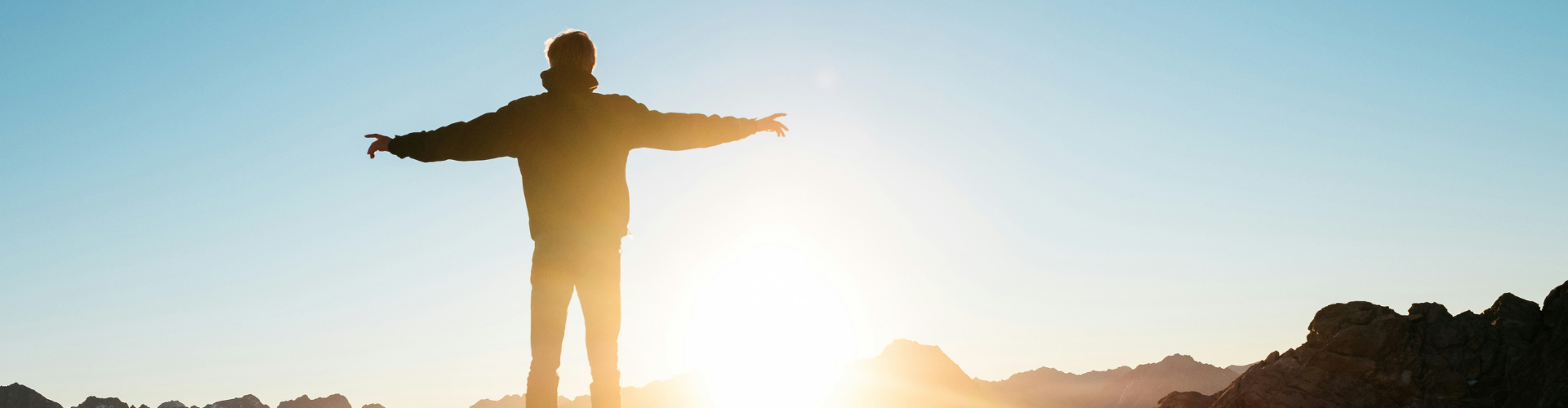 person standing on hill