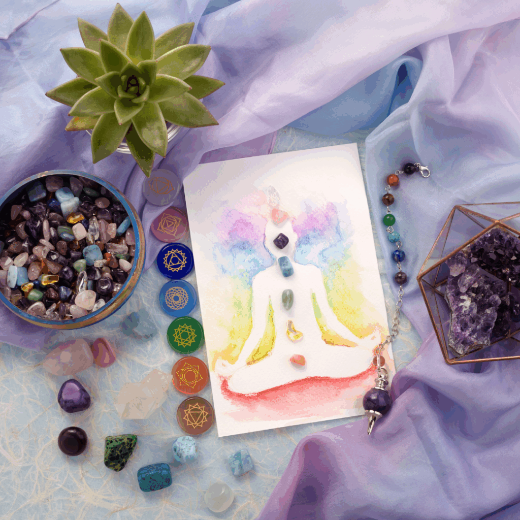 Natural crystals and pendulum on pastel silk background. Reiki background with card.