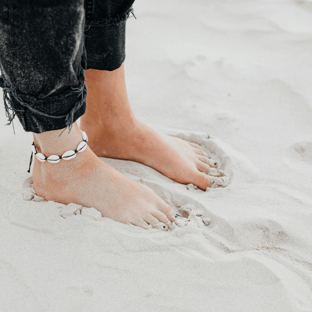 Person Standing on Brown Sand