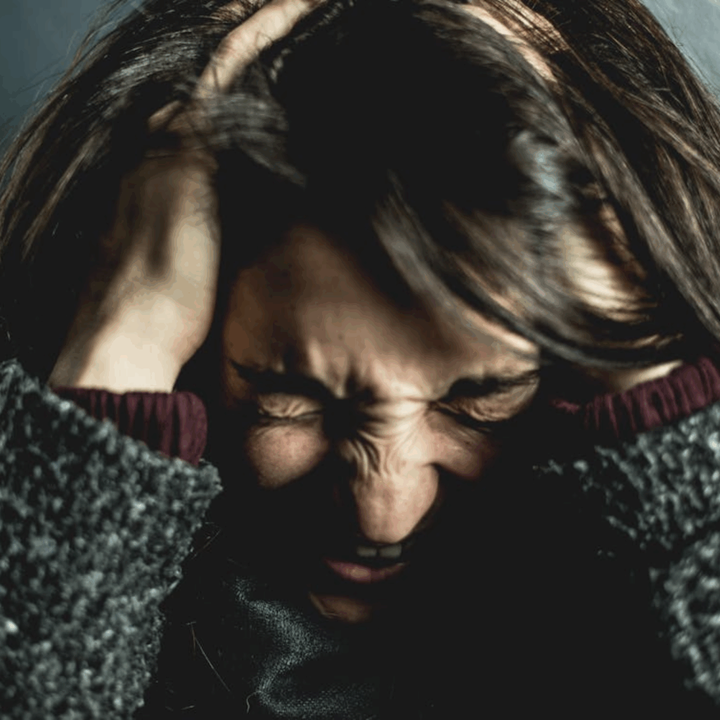 Woman Holding Her Head