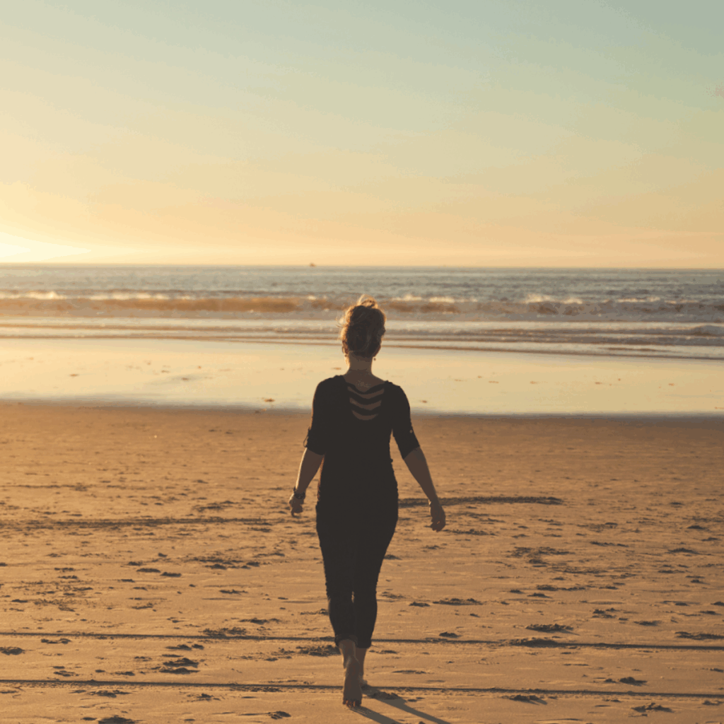 Person Walking on Beachshore