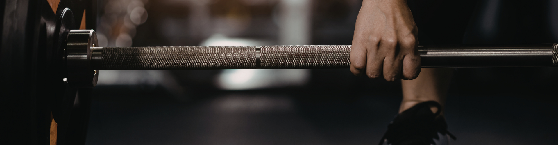 Person lifting weights in gym