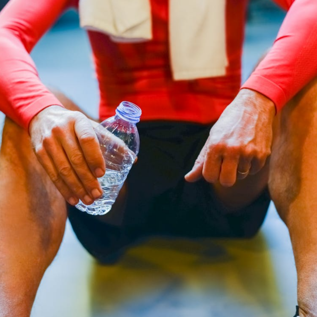 Person Holding a Water Bottle